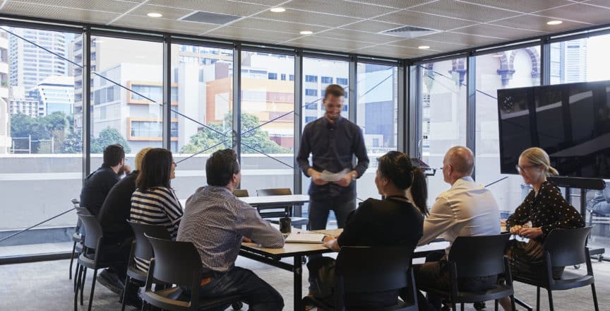 team having a workshop in a meeting room