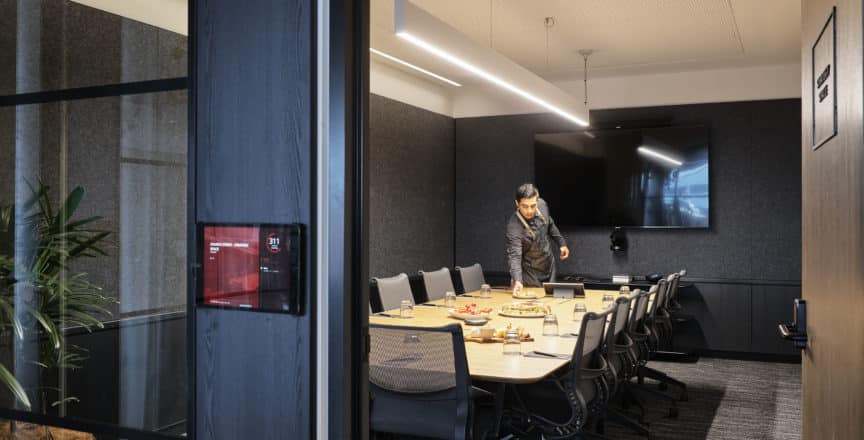 meeting room with catering on table and a waiter
