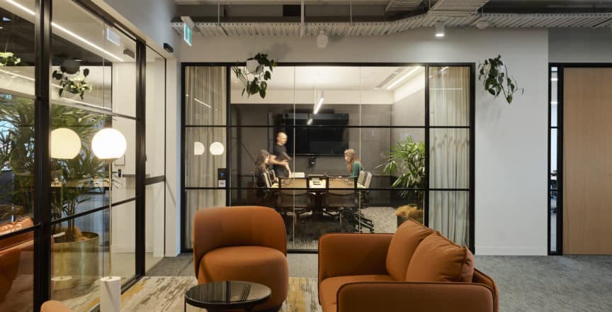 meeting room with chairs behind it