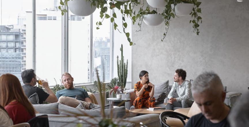 People sitting on a couch talking