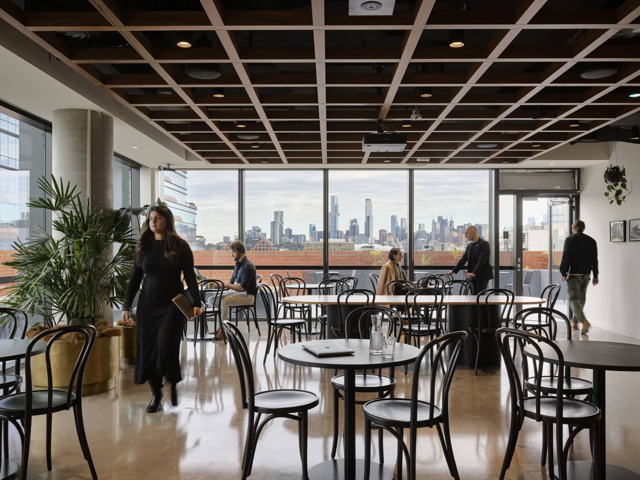people walking around a cafe