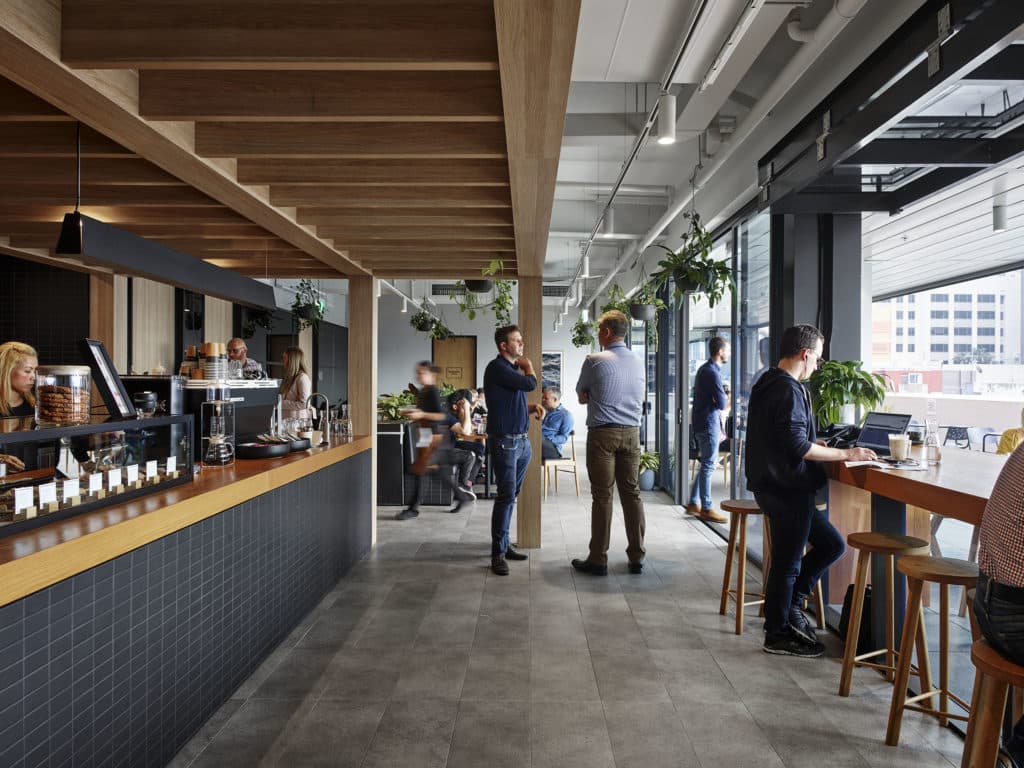 Hub Hyde Park café area with people standing in it