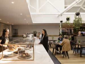 woman waiting at a cafe counter