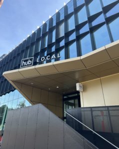 exterior of building with a a sign saying Hub Local
