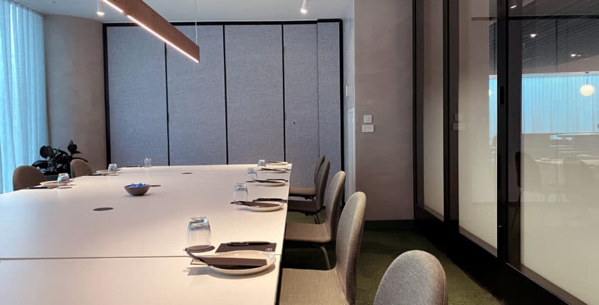 meeting room with long white table and chairs