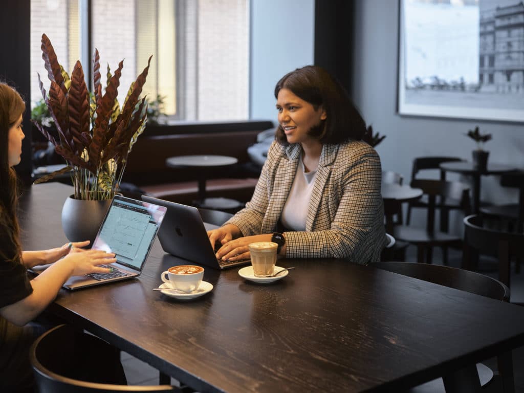 women meeting over coffee and laptops