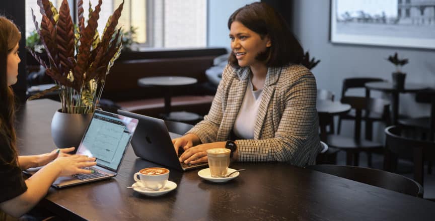 women meeting over coffee and laptops