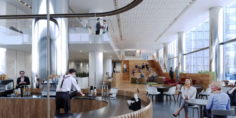 A bright and modern multi-level coworking space with a cafe on the ground floor, featuring a barista at a curved counter, people seated at tables, and others on a wooden staircase and upper levels, all under a high ceiling with large windows.