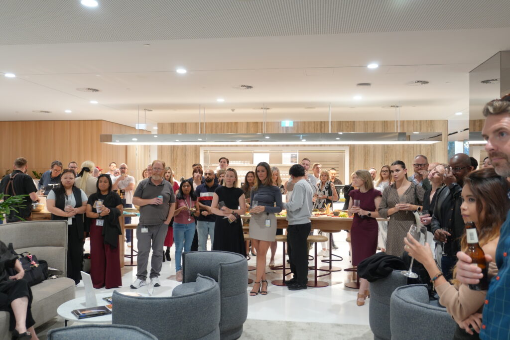 Professional working in a Hub workspace that supports DEIB in the workplace through inclusive design.